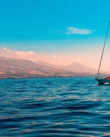 Sailboat on the water with the clouds in the background